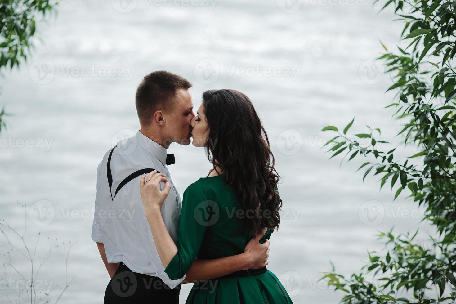 man and woman at the lake photo