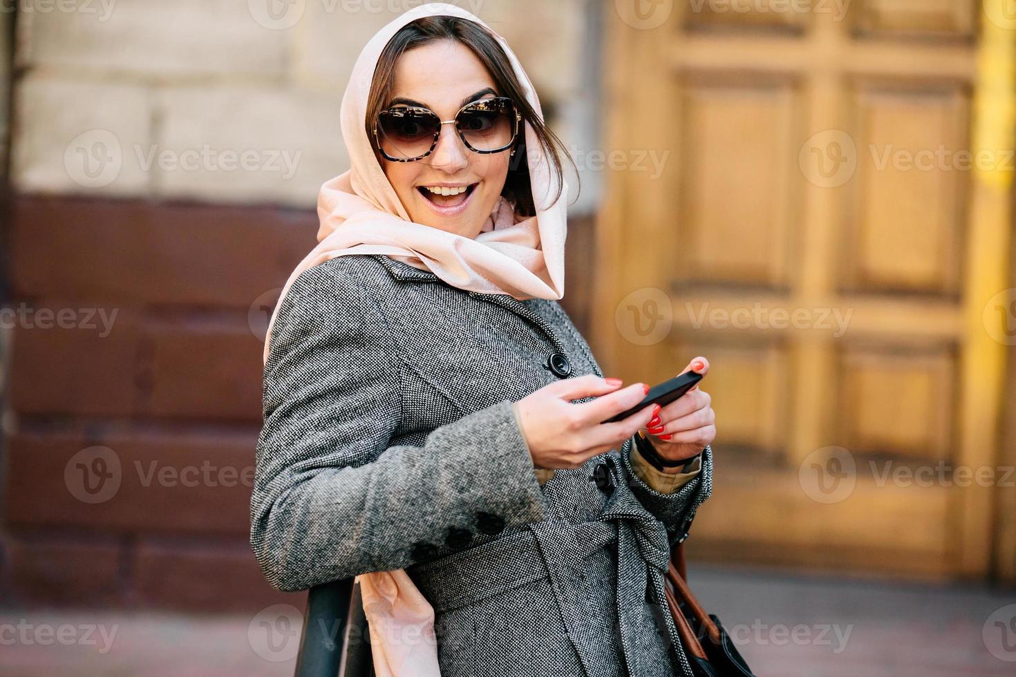 girl in a coat on the street photo