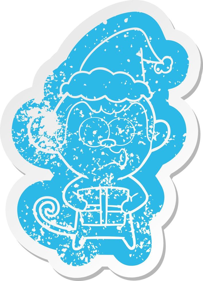 cartoon distressed sticker of a christmas monkey wearing santa hat vector