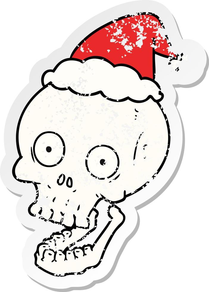 distressed sticker cartoon of a skull wearing santa hat vector