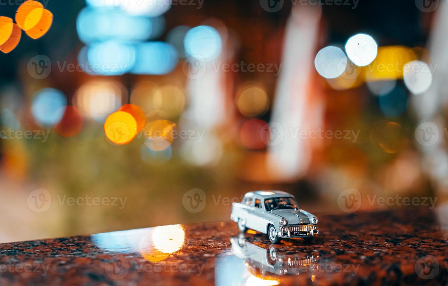 Moskvich 401 on the table, glowing background photo