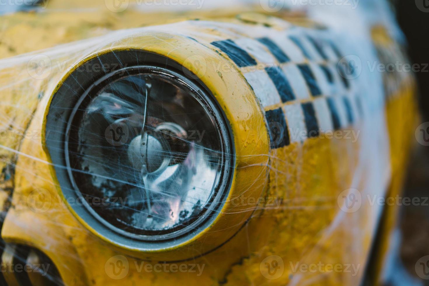 Old retro yellow taxi decorated with cobwebs photo