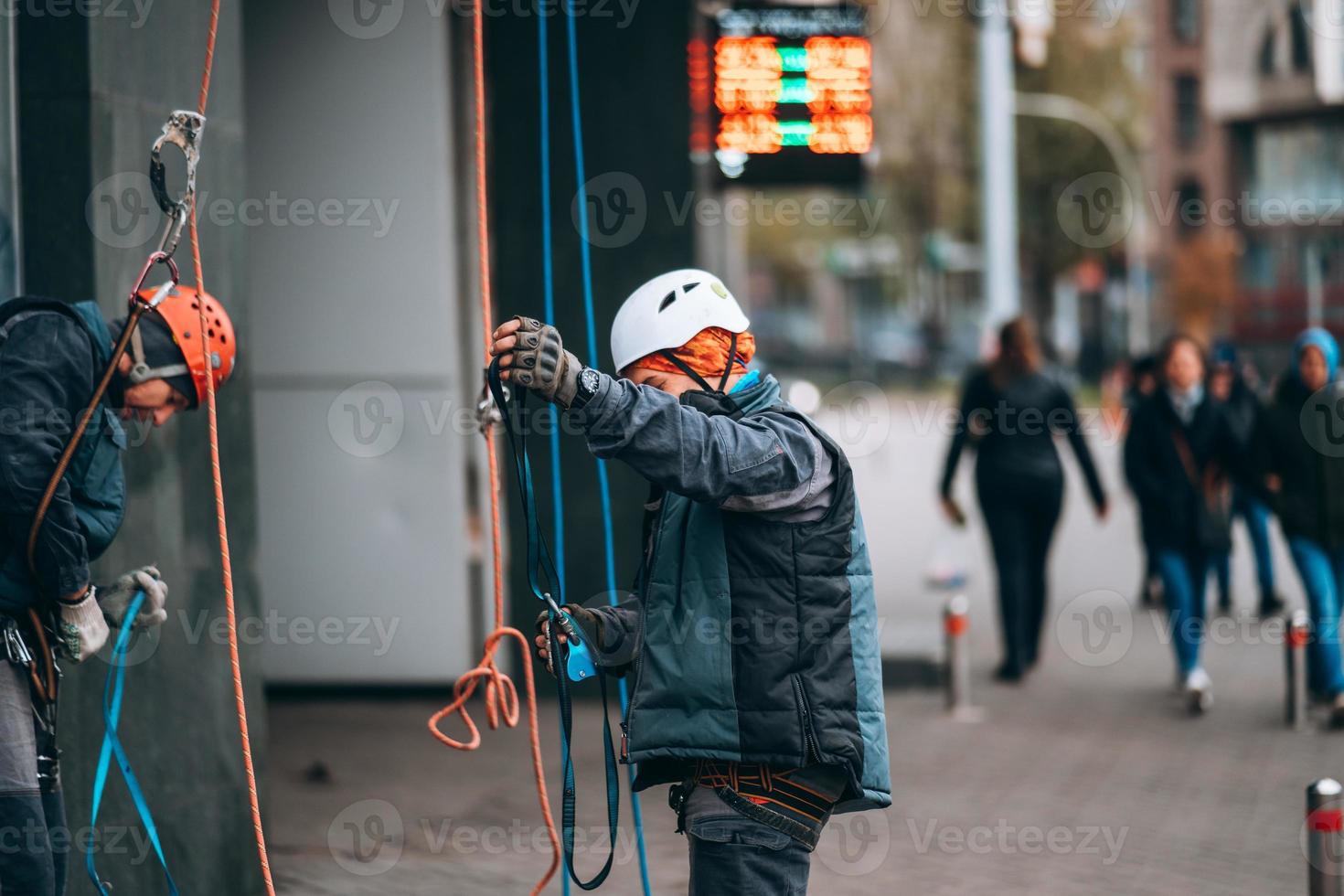 Worker climber preparing for work at height. photo