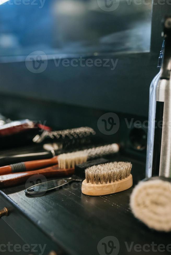 Combs and hairdresser tools side view at barbershop photo