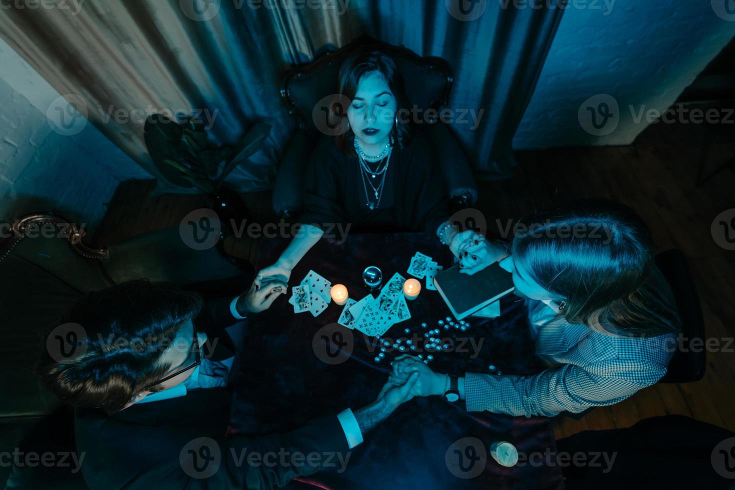 People hold hands of night at table with candles photo