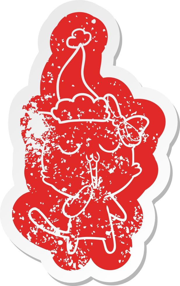 cartoon distressed sticker of a cat wearing santa hat vector