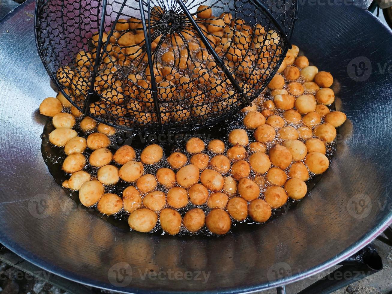 Cooking Sweet potato ball or Thai call Khanom khai nok kratha. made from sweet potatoes and flour mold ball sphere photo
