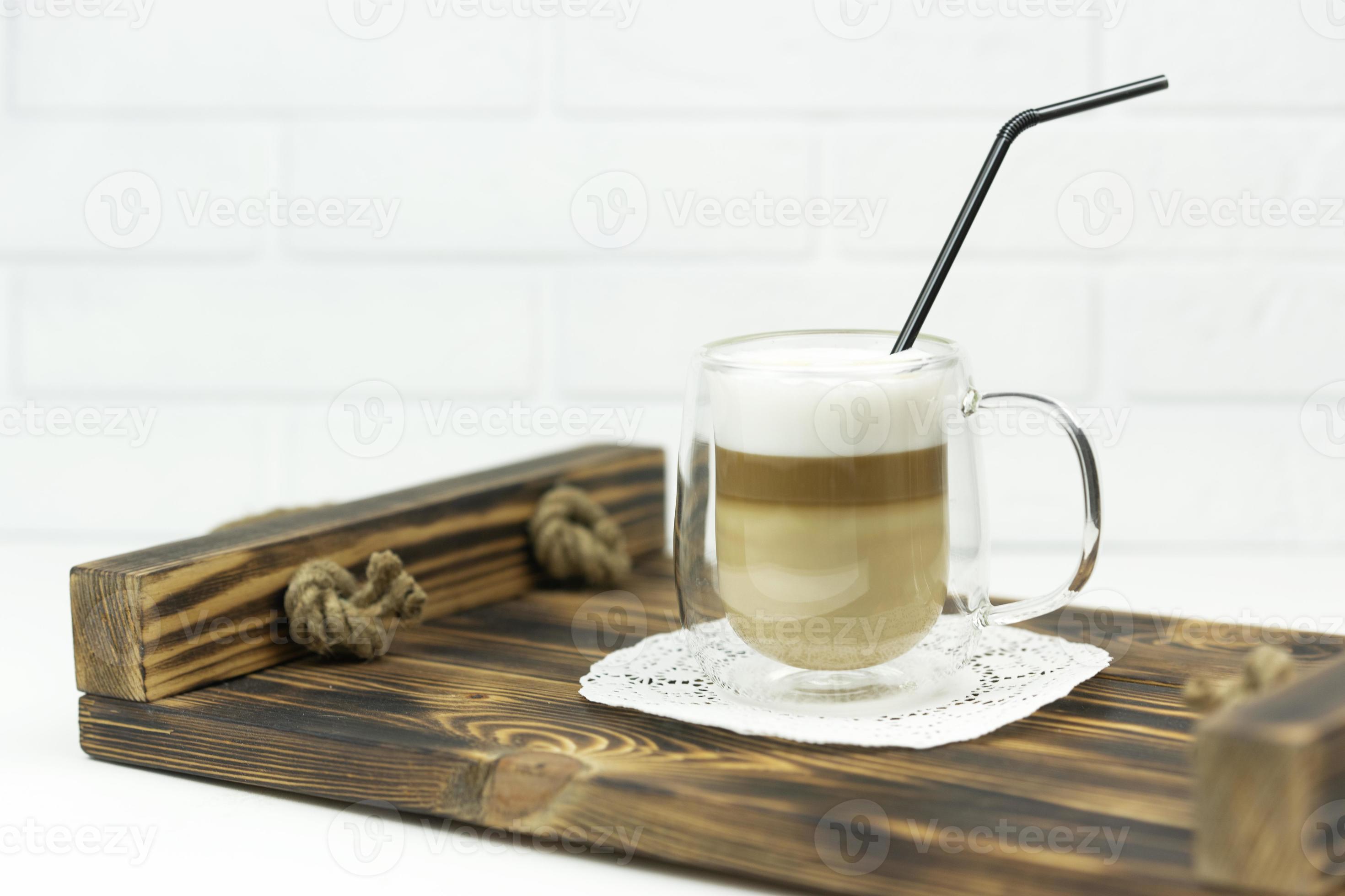 A cup of latte stands on a wooden tray for early breakfast 11771456
