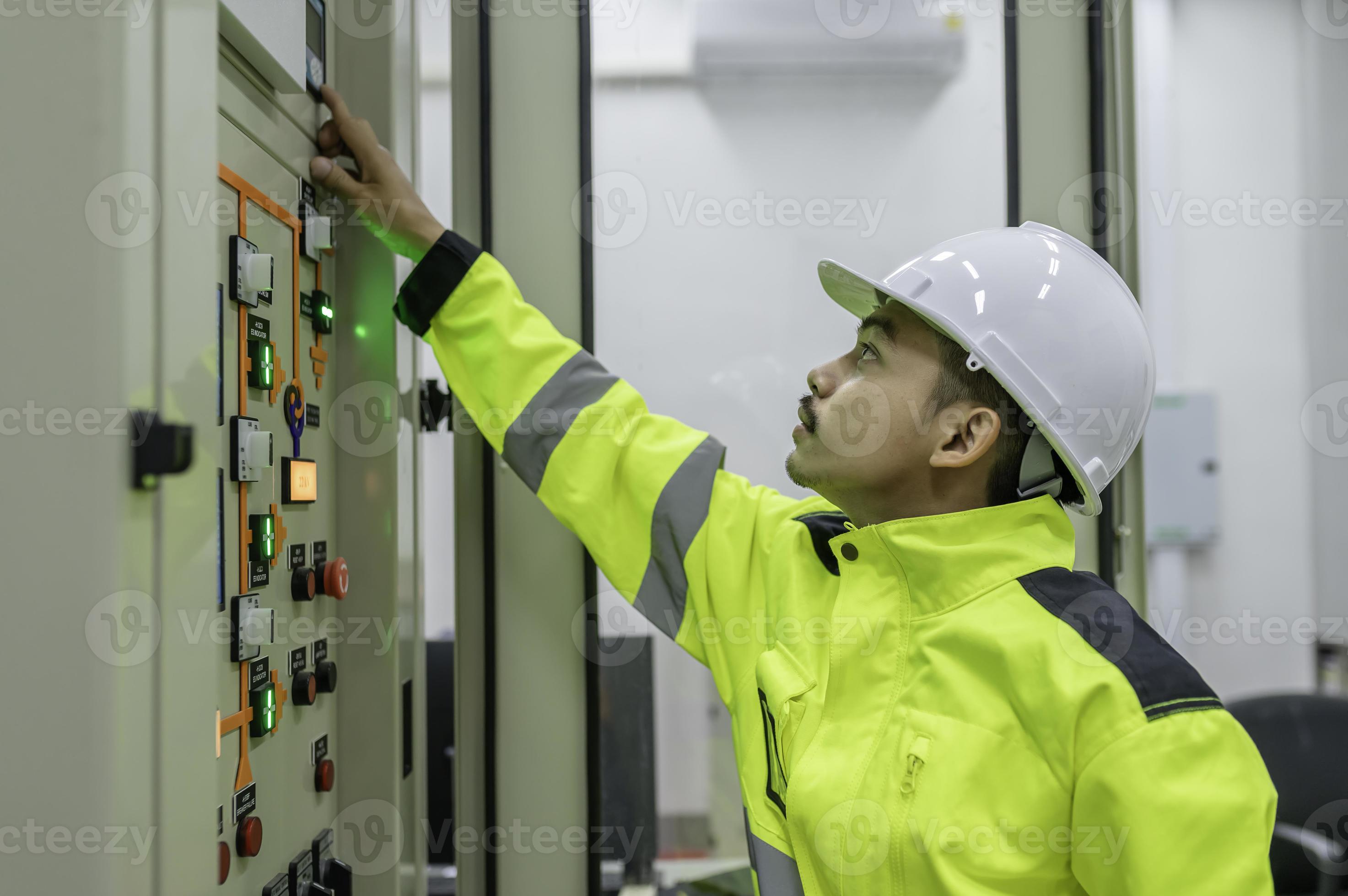 Electrical engineer man checking voltage at the Power Distribution