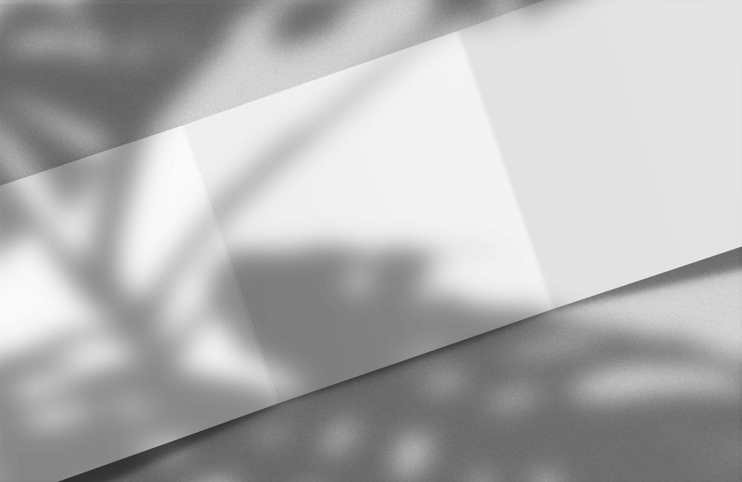 Blank white tri folded booklet mock up, opened, front and back side, top view, 3d rendering. Plain trifold brochures mockups set isolated. Book cover and three flier inside with shadow overlay. photo