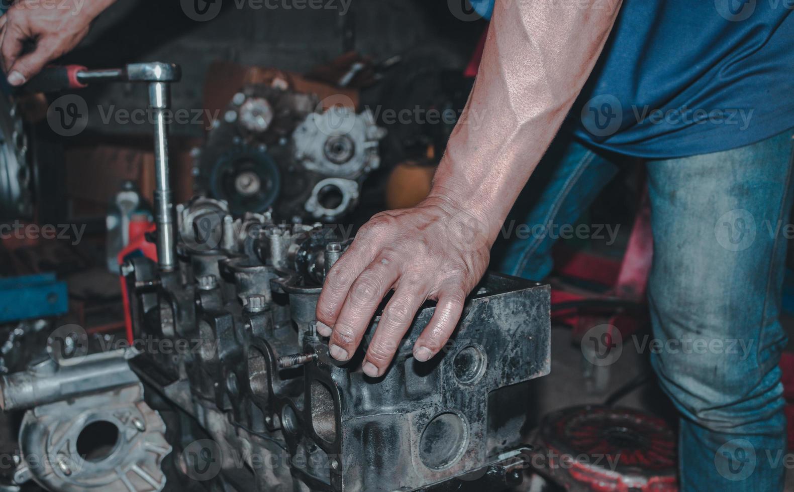 The mechanic is checking the engine. photo