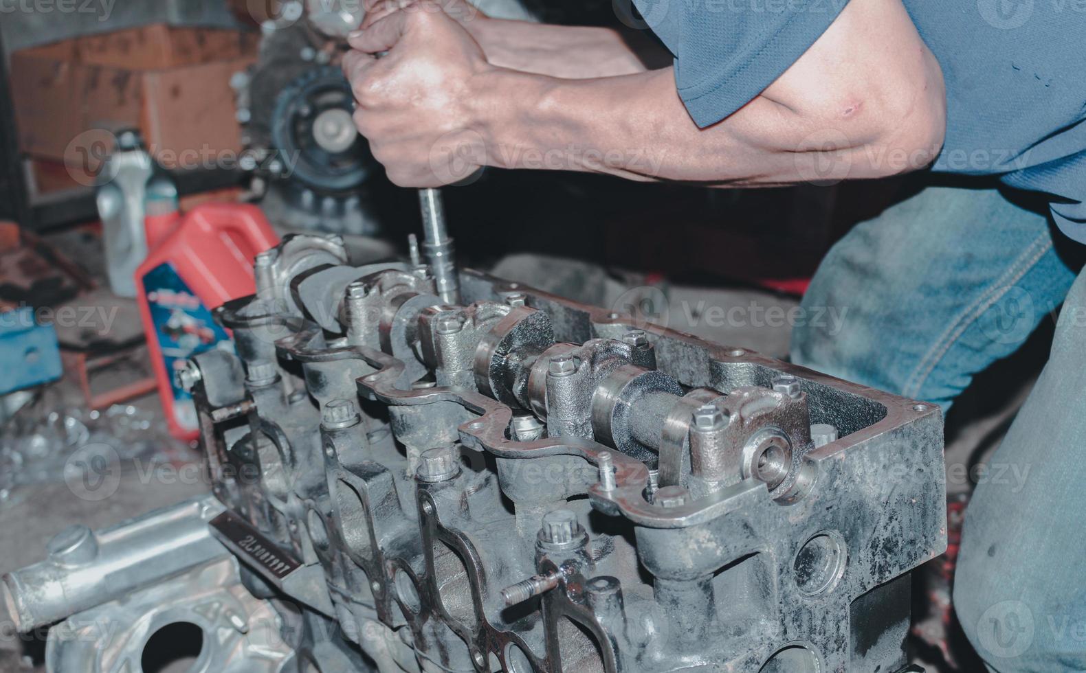 The mechanic is checking the engine. photo