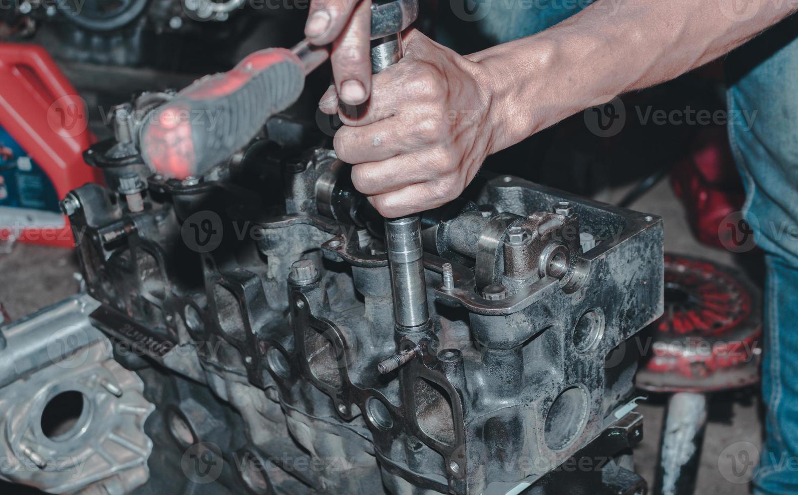 The mechanic is checking the engine. photo