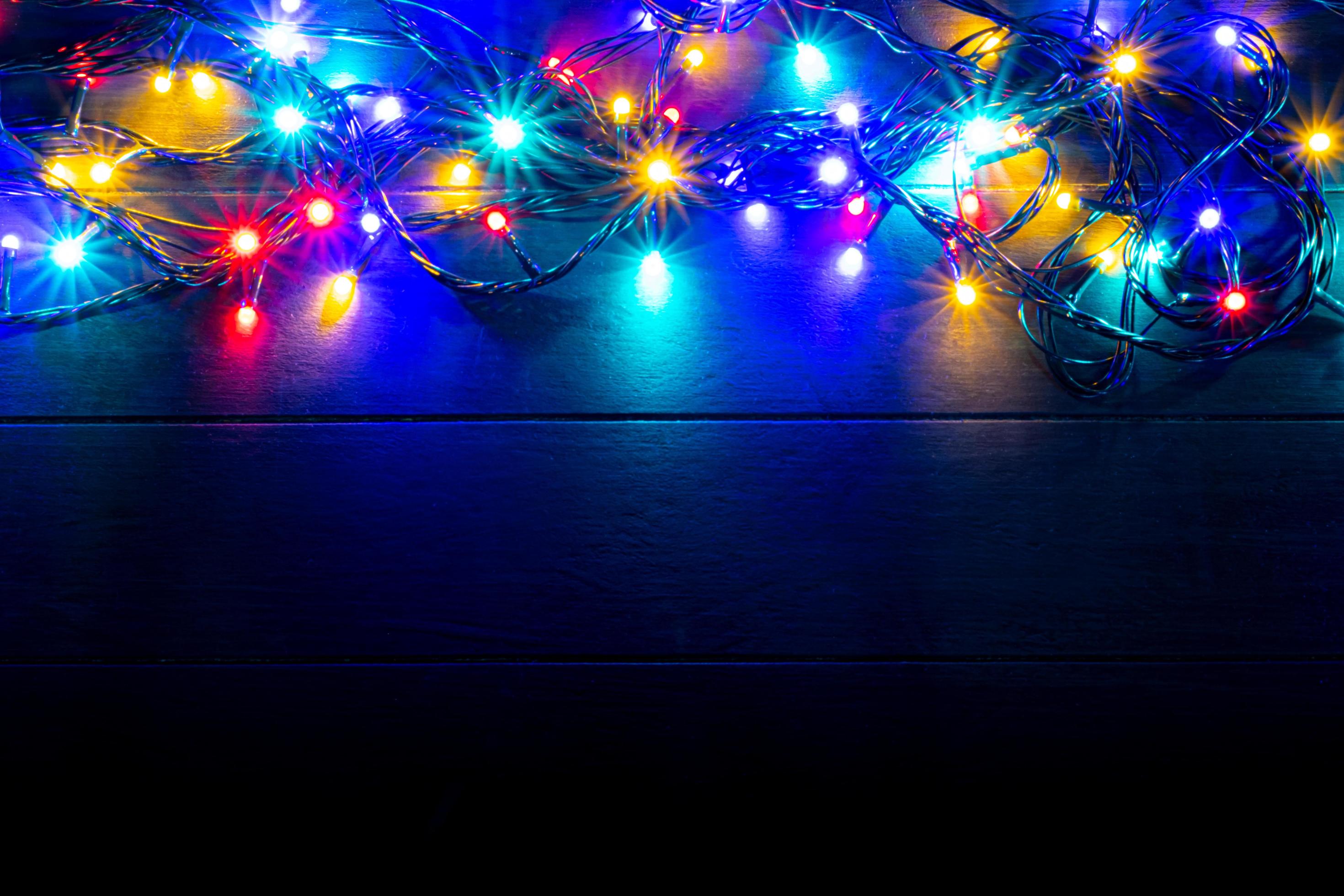 Christmas lights background with free text space. Glowing colorful
