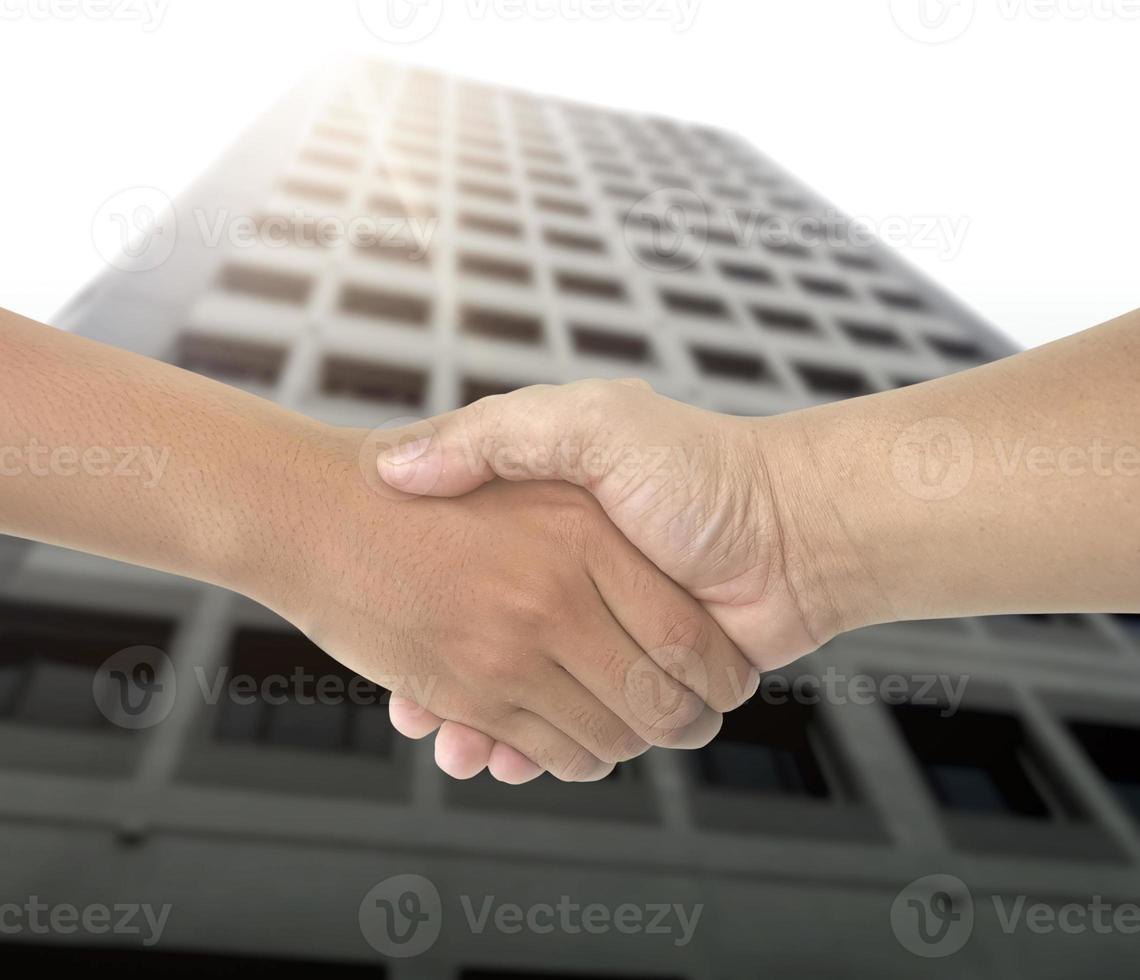 The businessmen shake hands after the meeting was successful and agreed upon photo