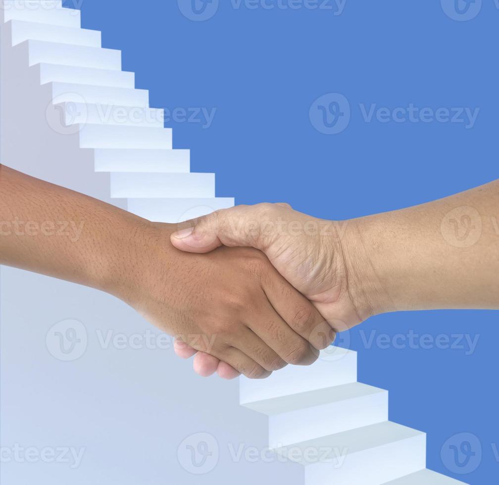 The businessmen shake hands after the meeting was successful and agreed upon photo