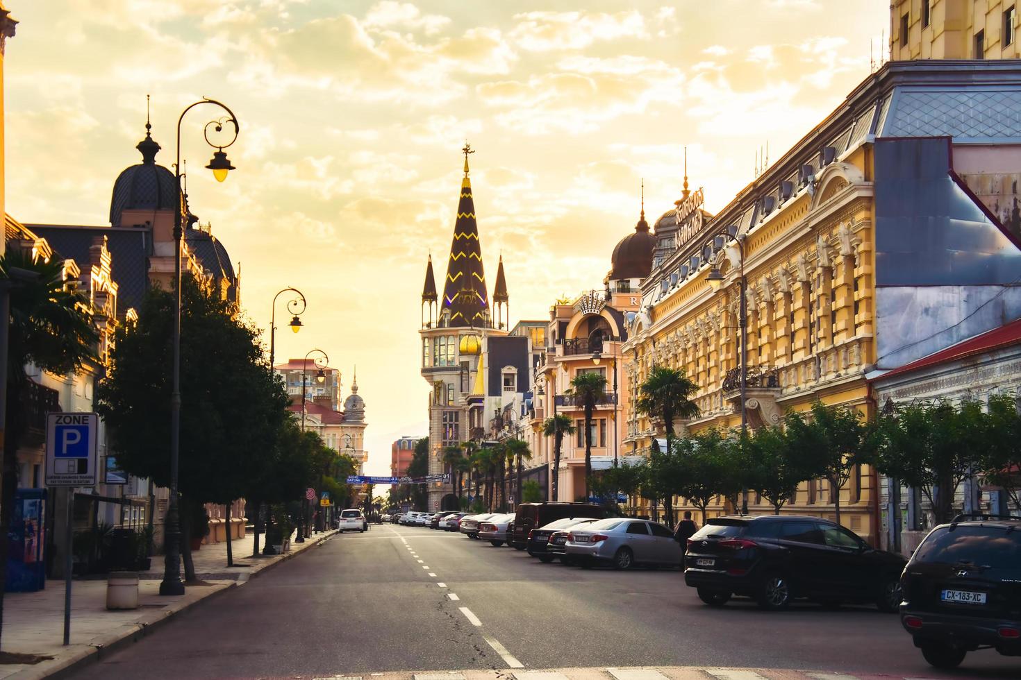 Batumi, Georgia, 2021 - cars in park early morning.Old town buildings architecture with cars parking outside in street photo