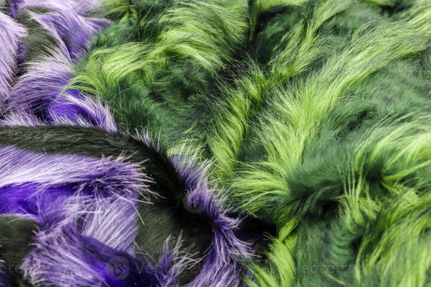 Detailed close up view on samples of cloth and fabrics in different colors found at a fabrics market photo
