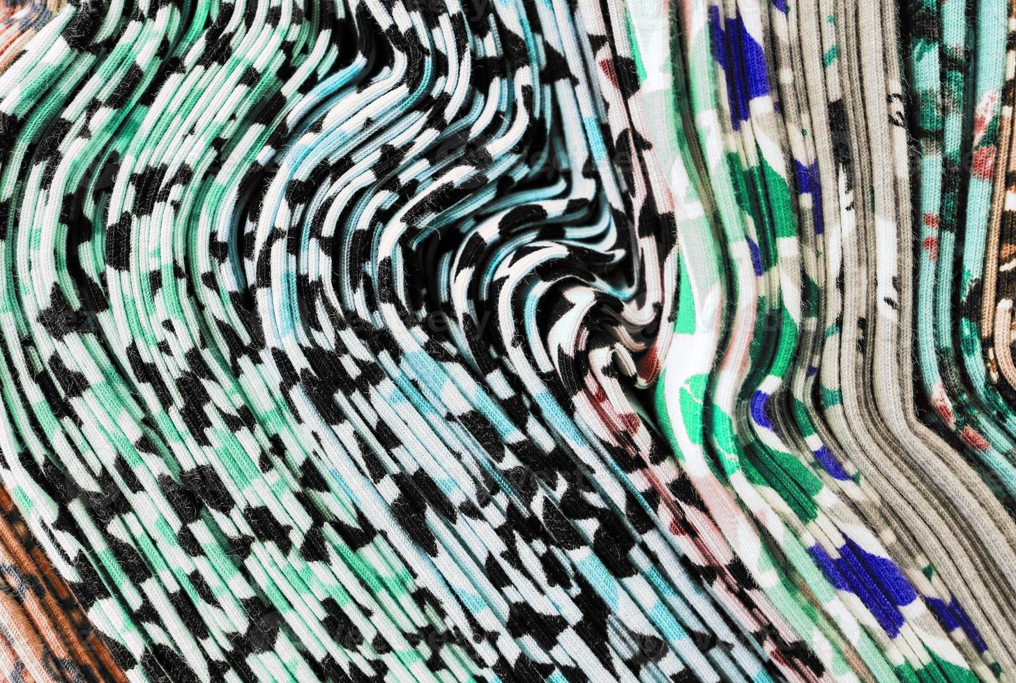 Detailed close up view on samples of cloth and fabrics in different colors found at a fabrics market photo