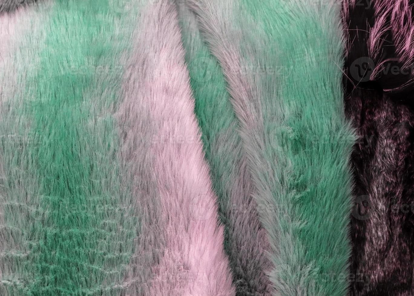 Detailed close up view on samples of cloth and fabrics in different colors found at a fabrics market photo