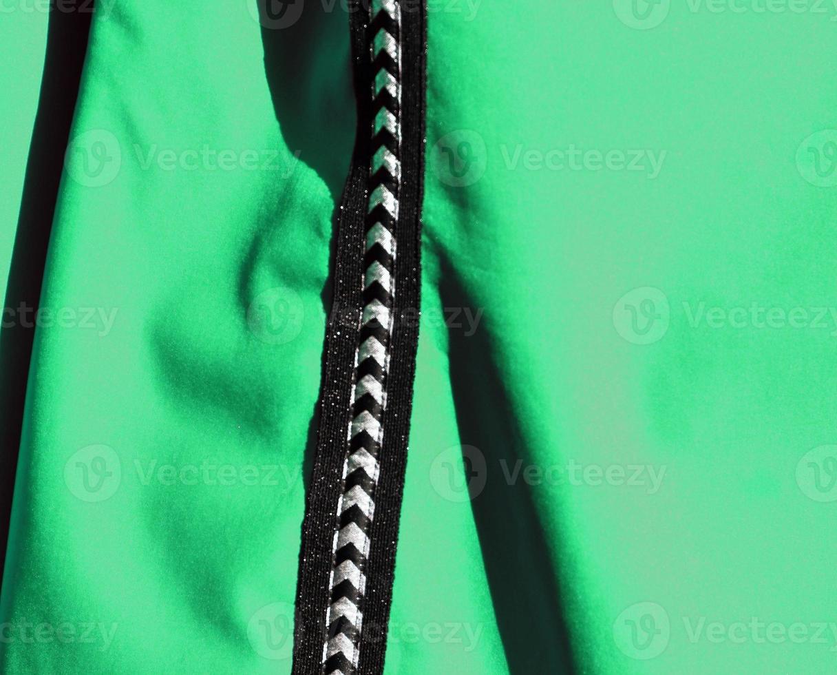 Detailed close up view on samples of cloth and fabrics in different colors found at a fabrics market photo