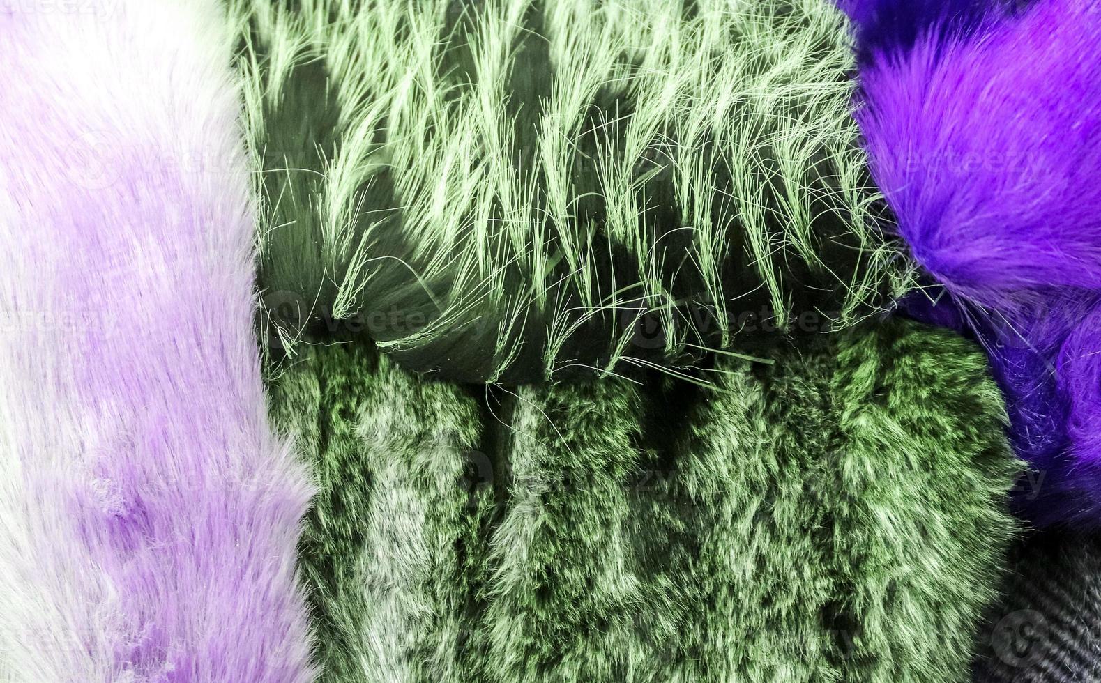 Detailed close up view on samples of cloth and fabrics in different colors found at a fabrics market photo