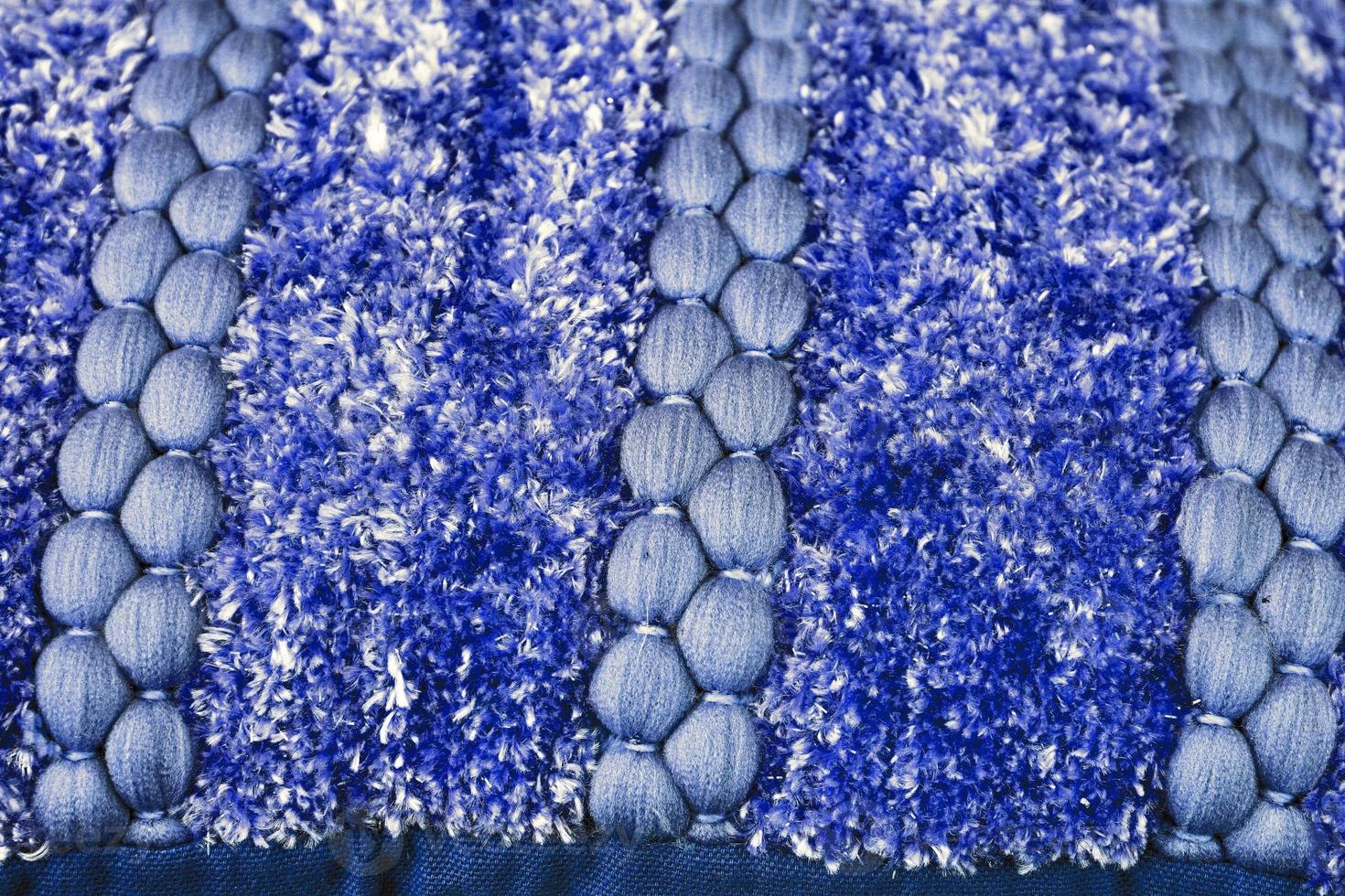 Detailed close up view on samples of cloth and fabrics in different colors found at a fabrics market photo