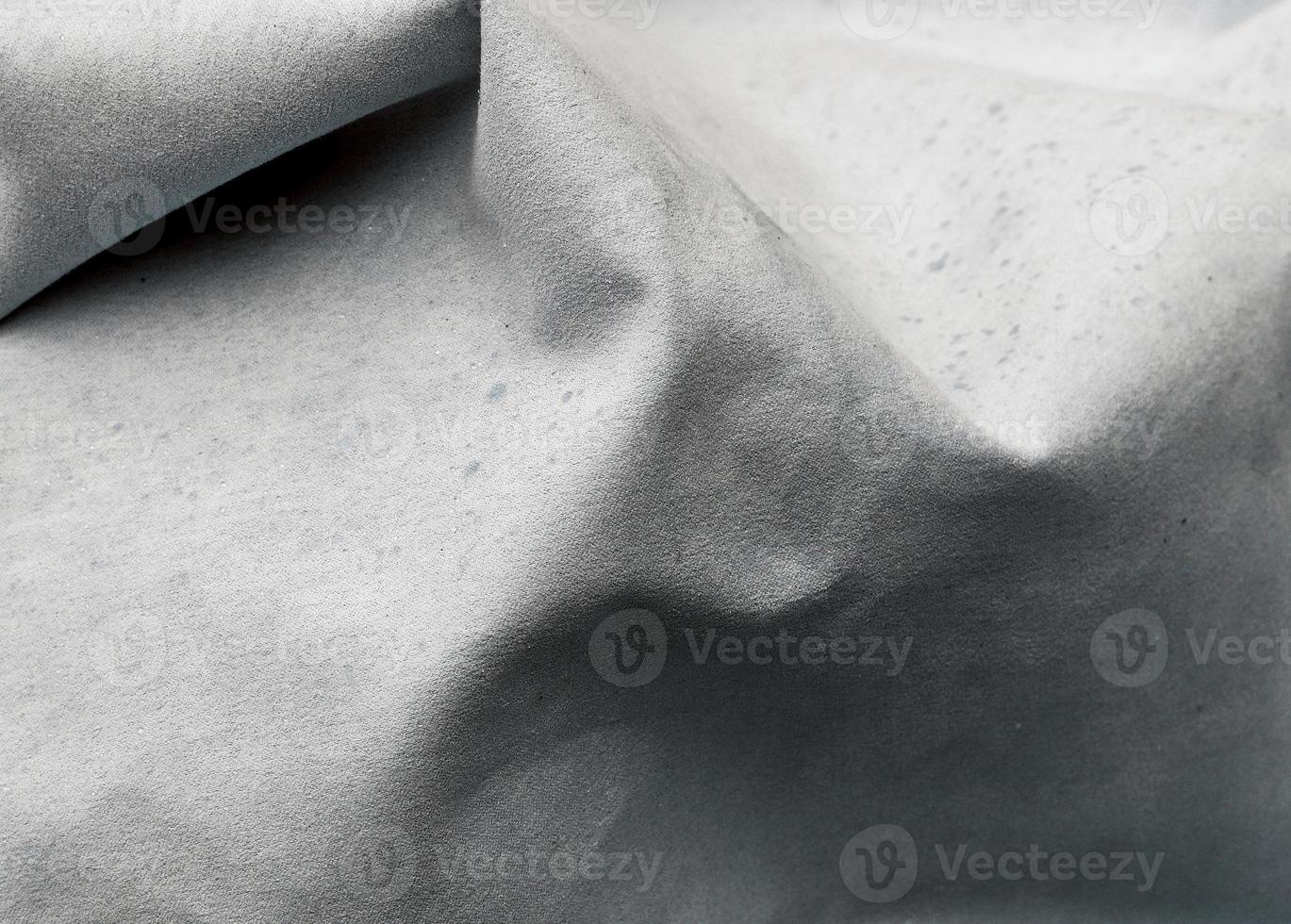 Detailed close up view on samples of cloth and fabrics in different colors found at a fabrics market photo