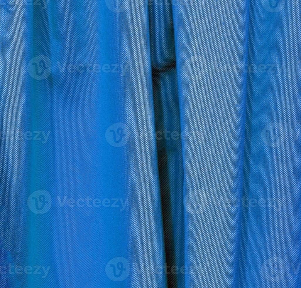 Detailed close up view on samples of cloth and fabrics in different colors found at a fabrics market photo
