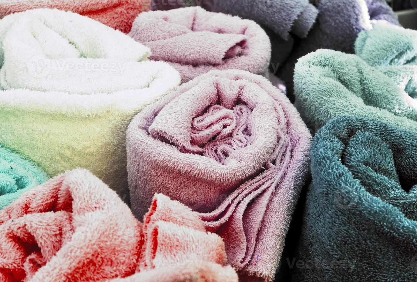 Detailed close up view on samples of cloth and fabrics in different colors found at a fabrics market photo