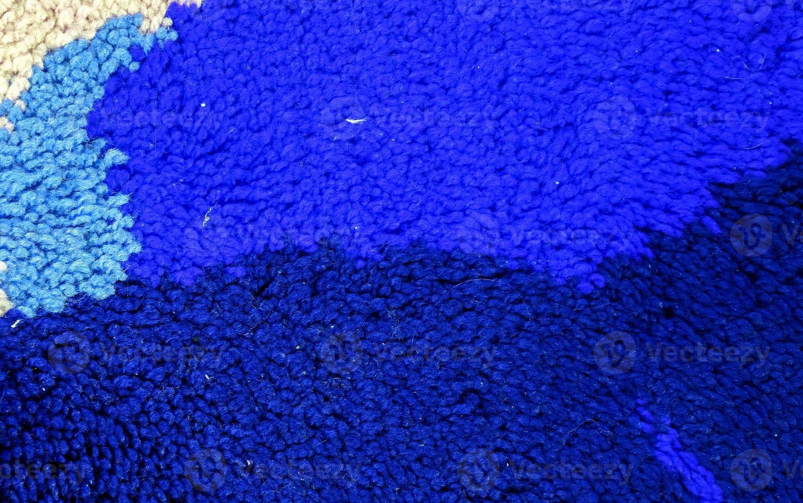 Detailed close up view on samples of cloth and fabrics in different colors found at a fabrics market photo