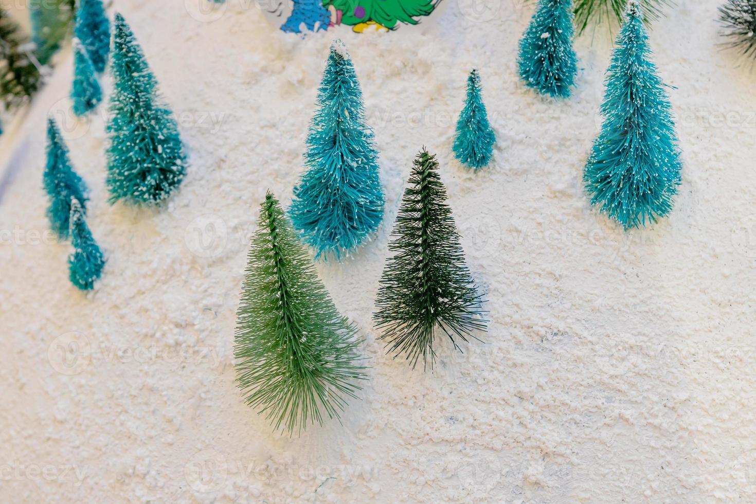 festive new year background with miniature christmas trees. Pattern design for backdrop. Minimal style photo
