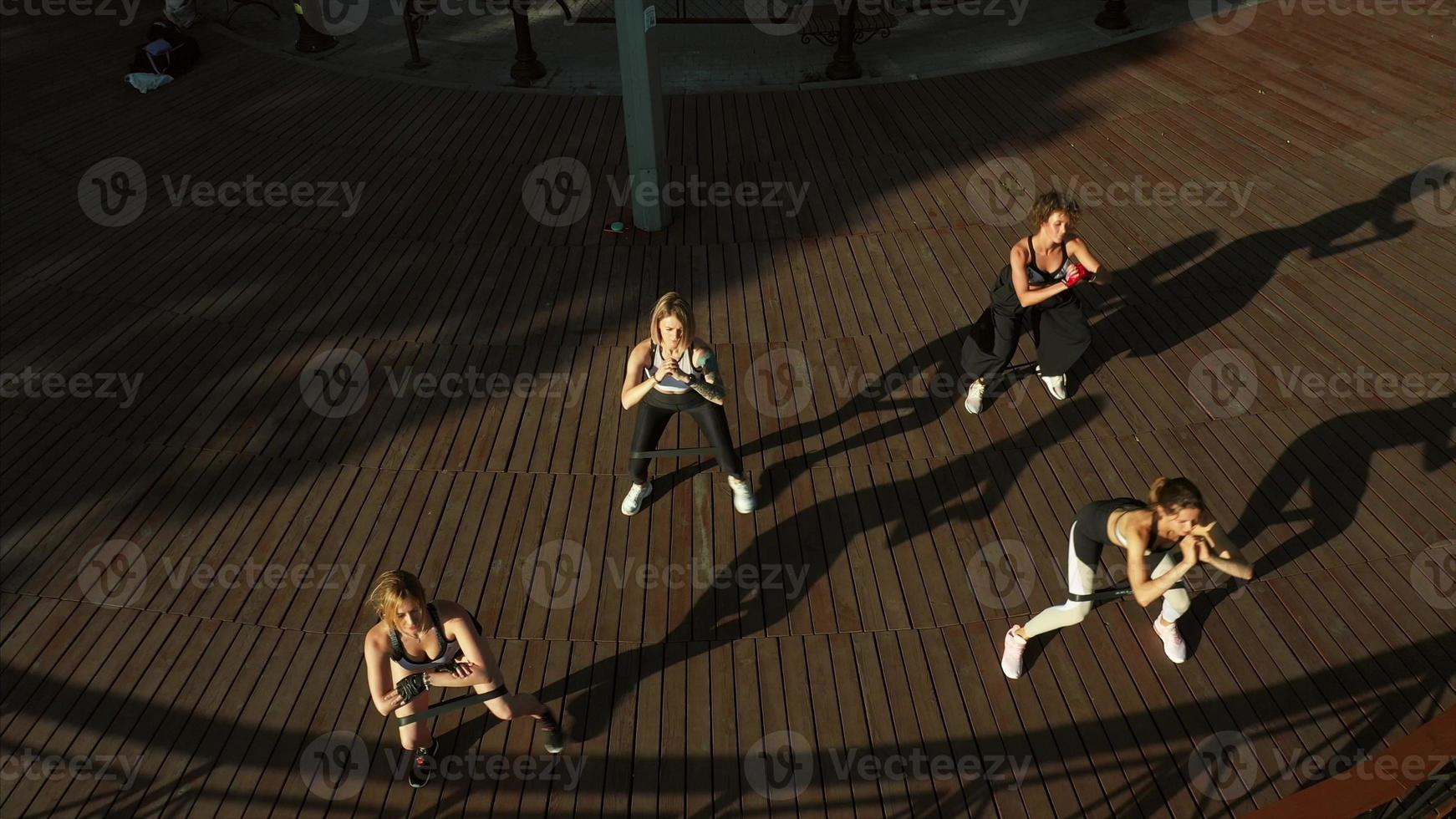 Girls athlete engaged in sports. Athletic young women doing morning exercises. photo