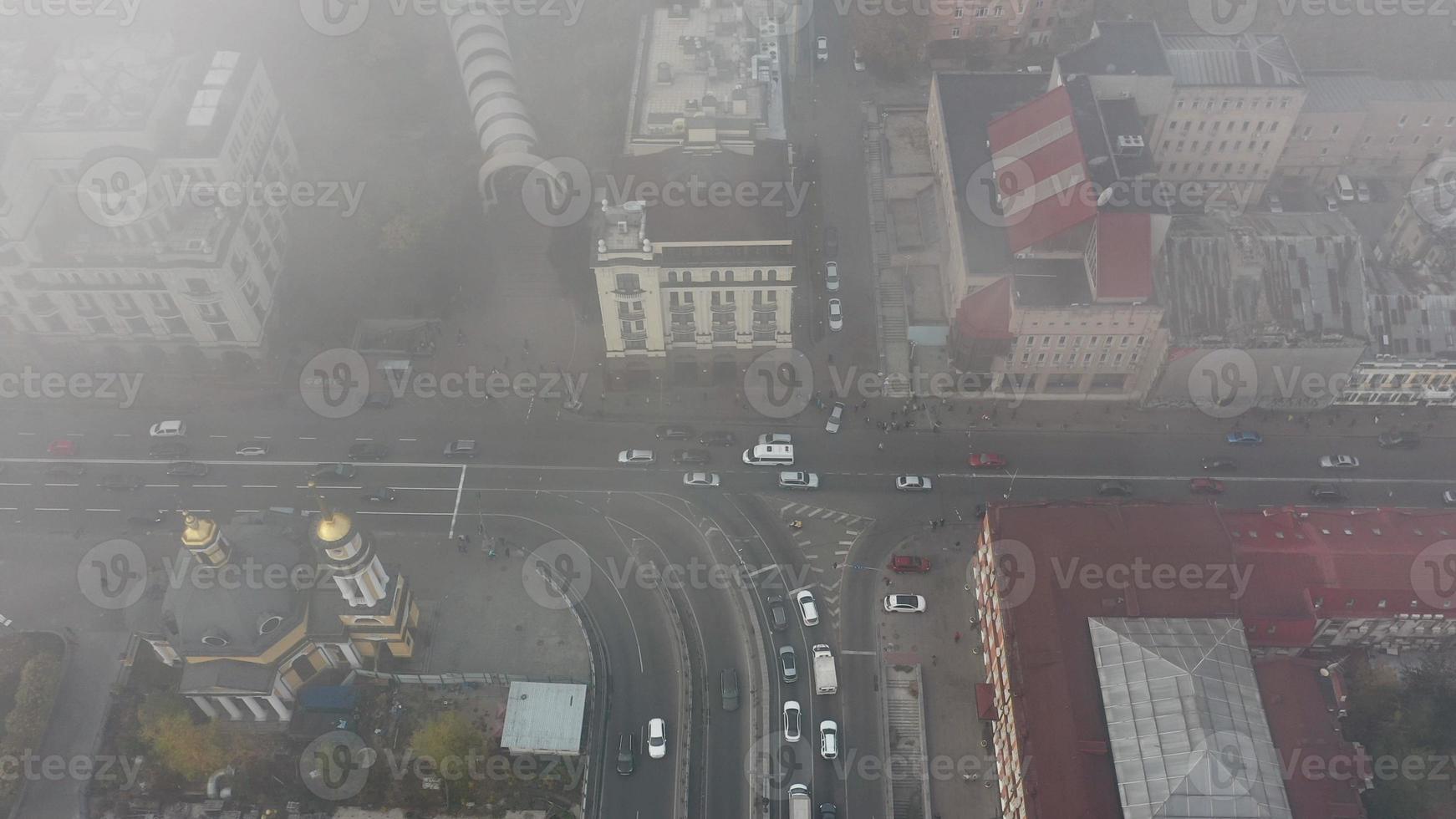 A city covered in fog. City traffic, aerial view photo