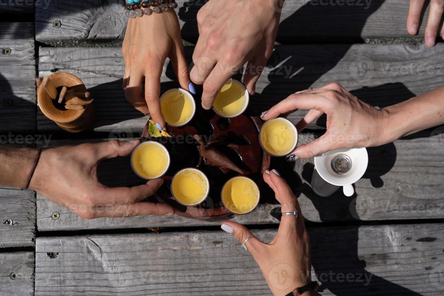 Top view tea set a wooden table for tea ceremony background. Woman and man holding a cup of tea photo