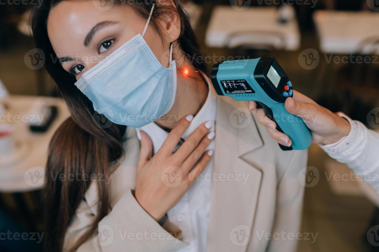 Measuring Body Temperature With Contactless Body Thermometer 11782970 measuring-body-temperature-with-contactless-body-thermometer-11782970