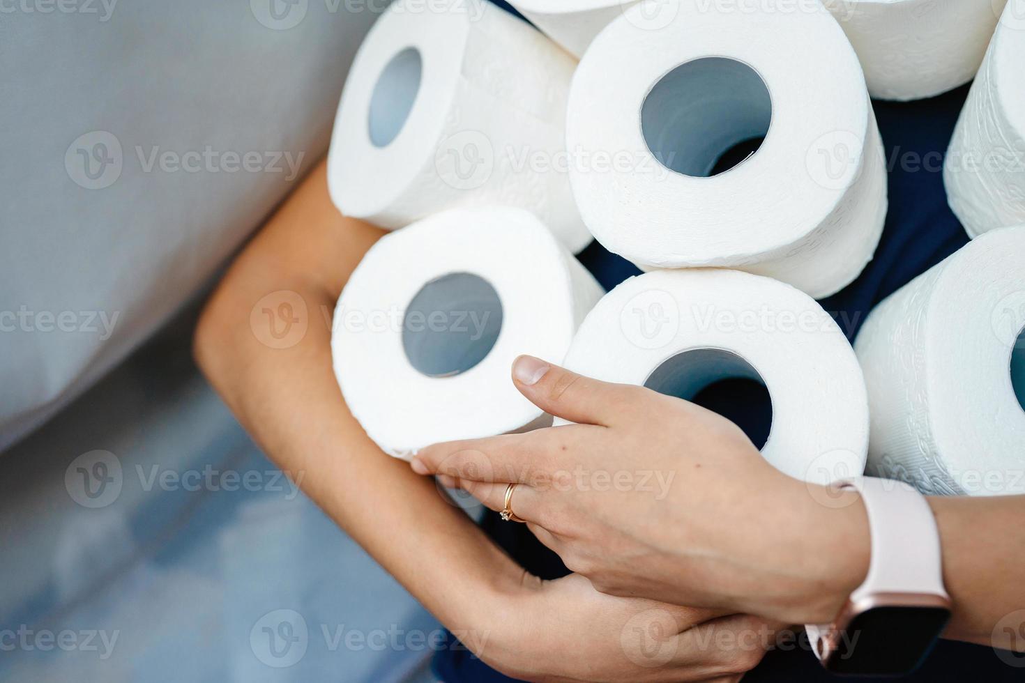 People are stocking up toilet paper for home quarantine from crownavirus. photo