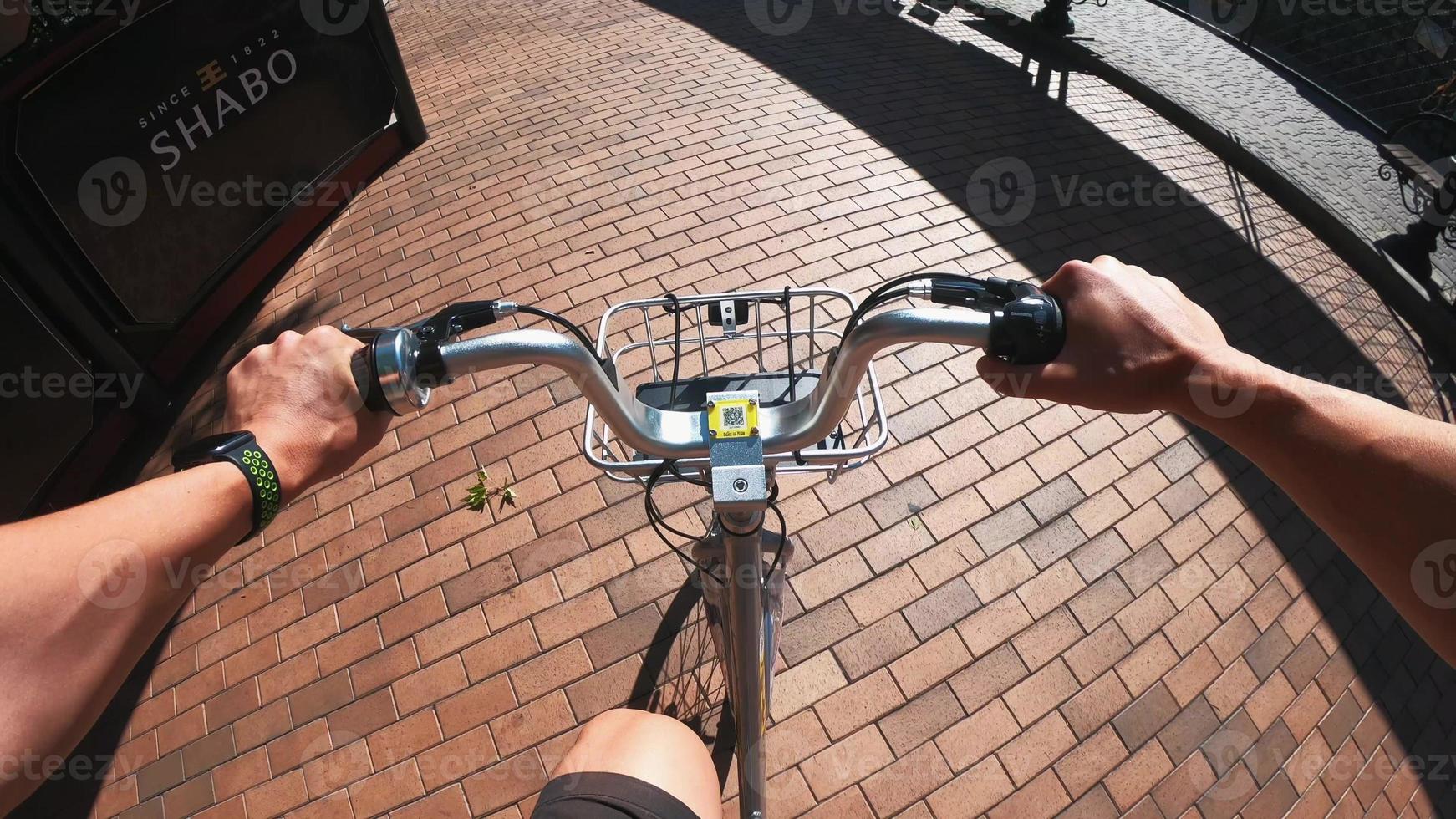 A view from the first person to the steering wheel, hands and road. photo