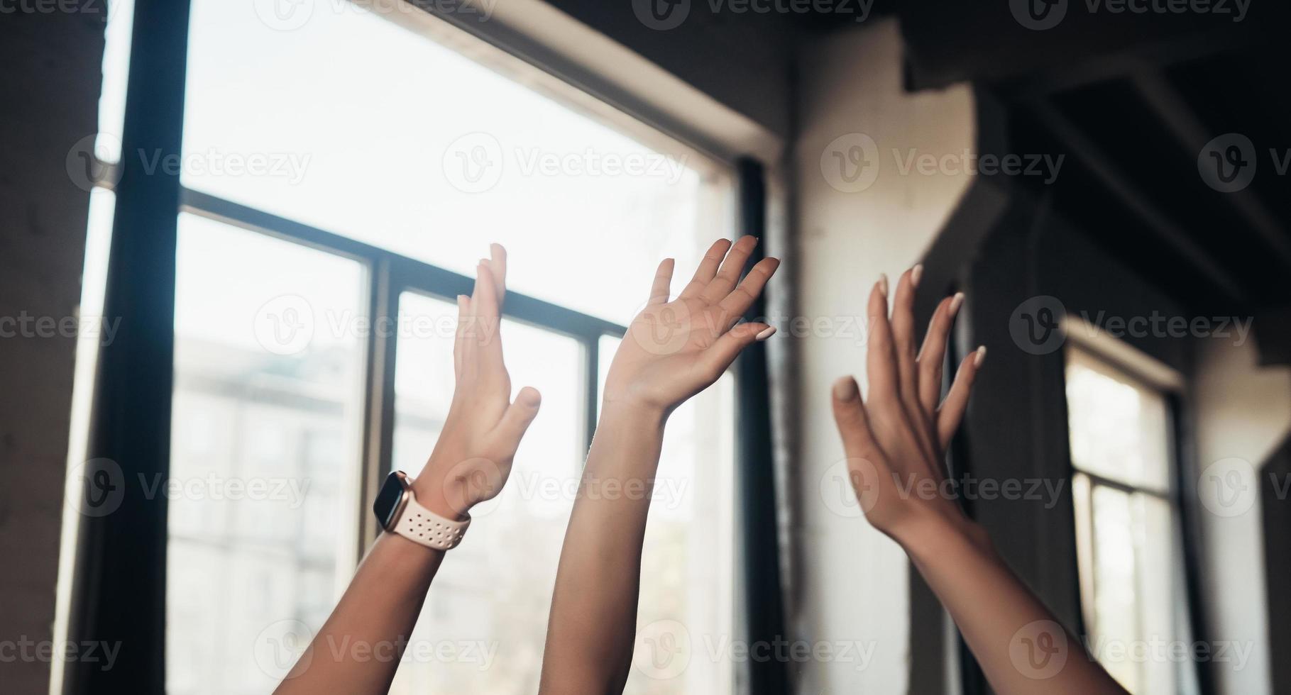 Women giving five each other after having a great workout in gym. photo