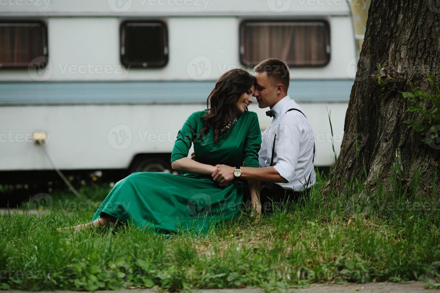 man and woman under a tree photo