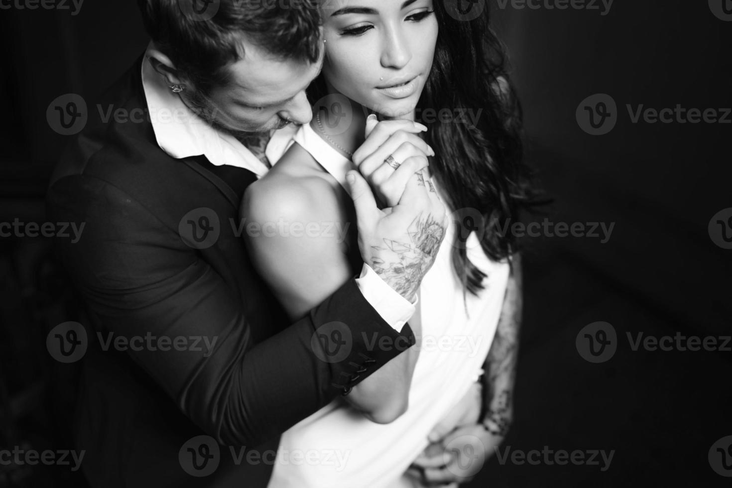 Beautiful, young couple posing on camera indoors photo