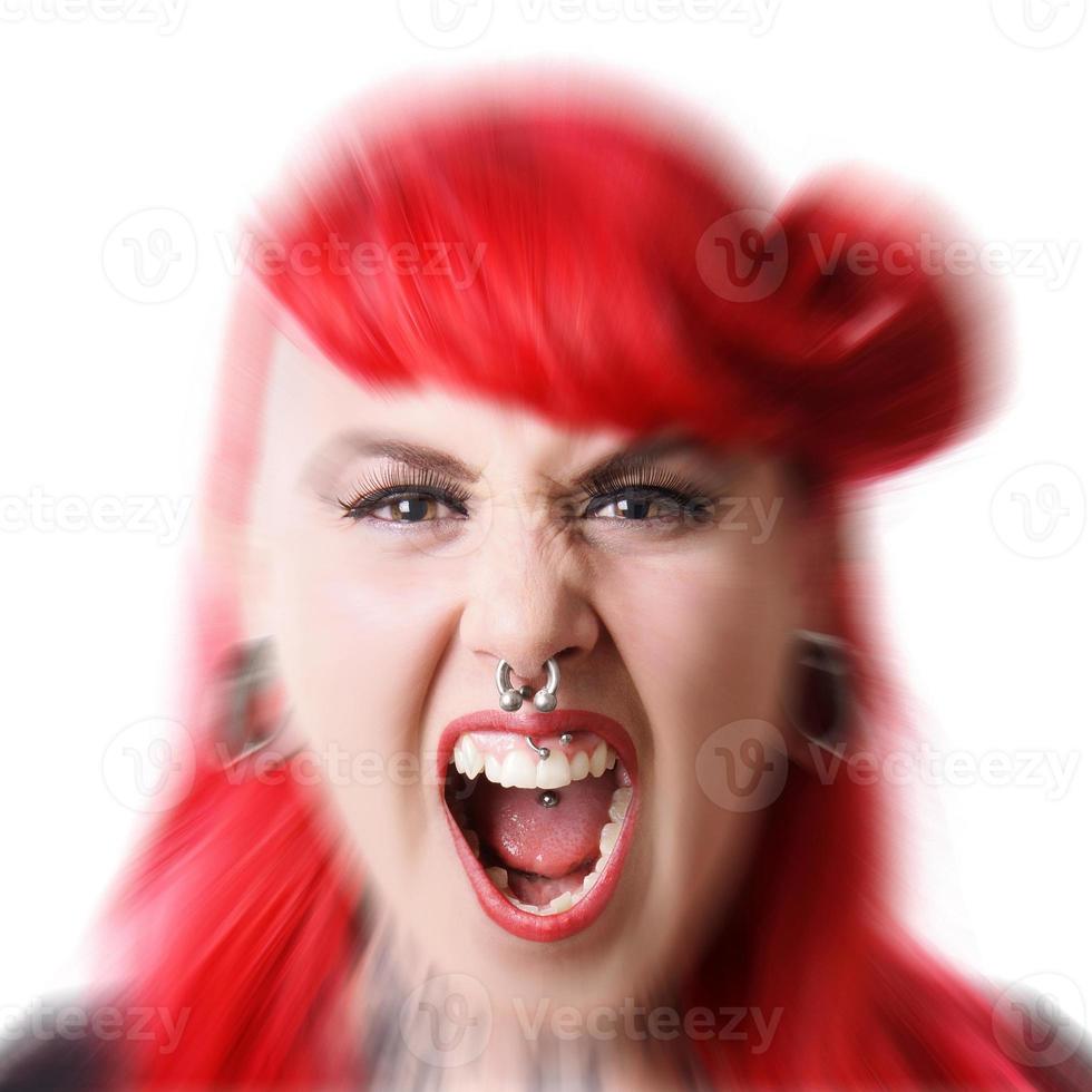 angry young woman with piercings screaming photo