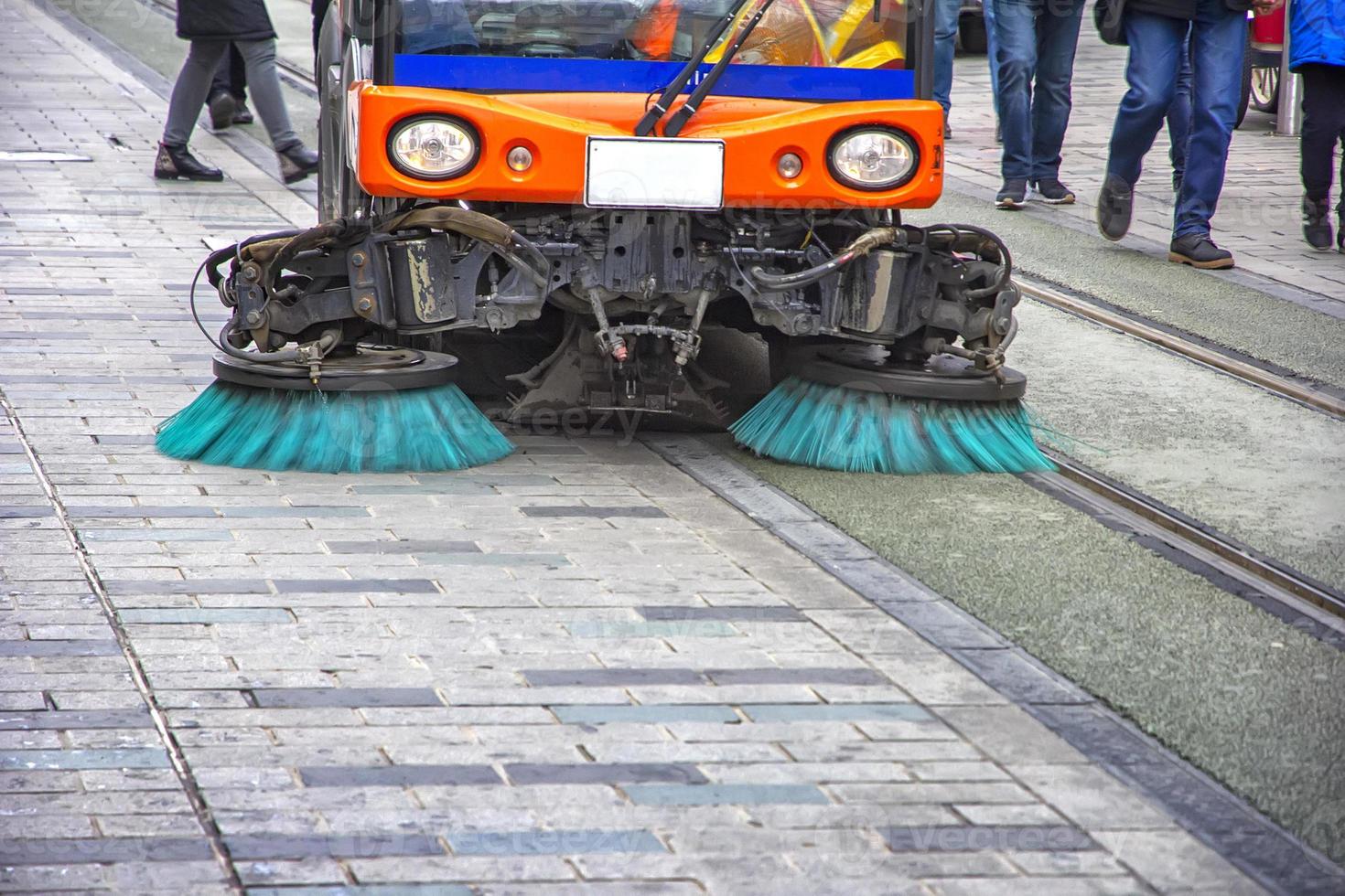 Sweeper truck, vehicle cleaning machine, clean urban road the streets in the city. Concept photo