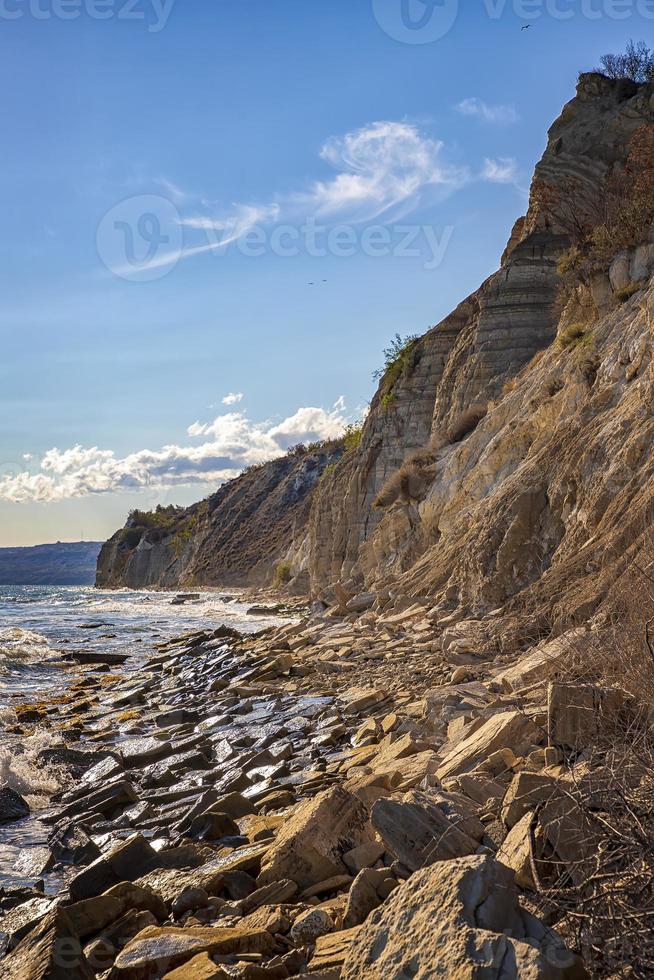 At a stone coastline at the Black sea. Vertical view. photo