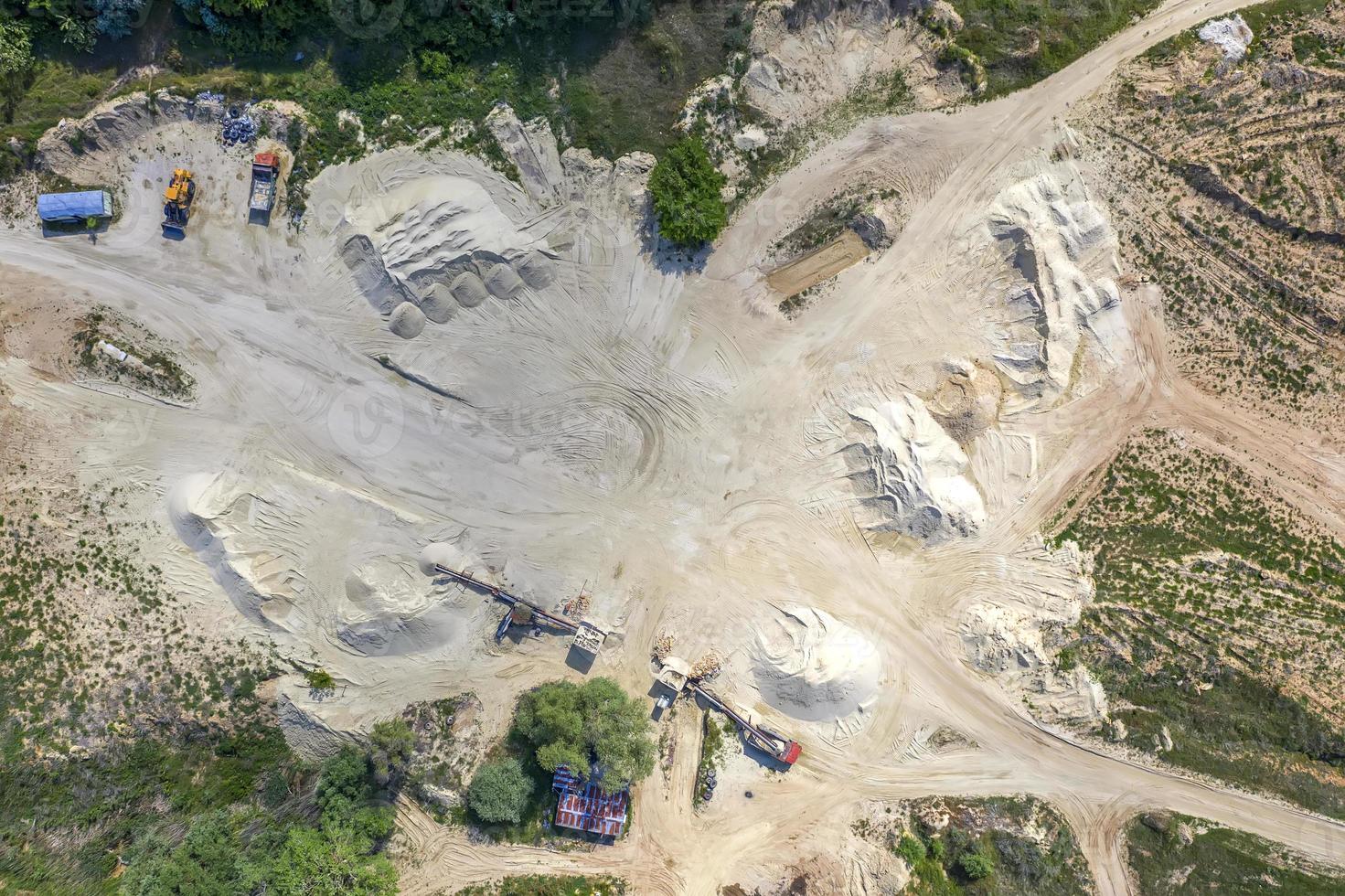 Top view on a quarry. Aerial view from drone on a mining of natural resources or ore photo