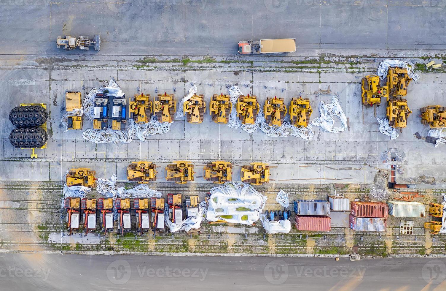 Aerial top view from drone of industrial equipment on port parking. Top view photo