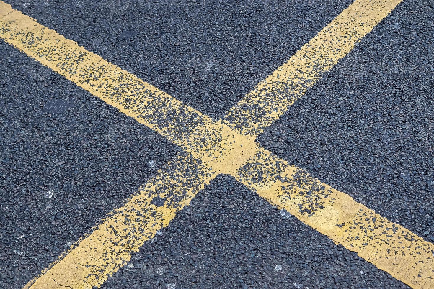 Detailed view on asphalt surfaces of different streets and roads with cracks photo