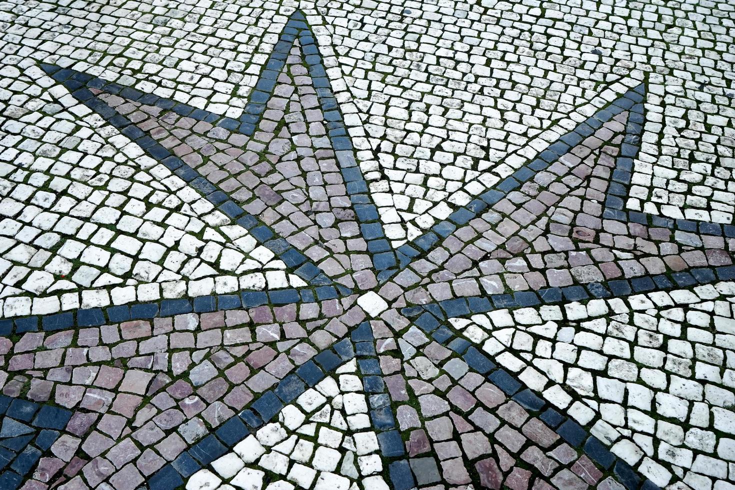 Prague, Czech Republic, 2014. Pattern in the pavement at the entrance to Charles Bridge in Prague photo