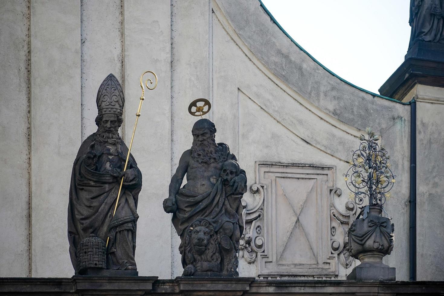 Prague, Czech Republic, 2014. Statues atop the Church of the Most Holy Saviour in Prague photo