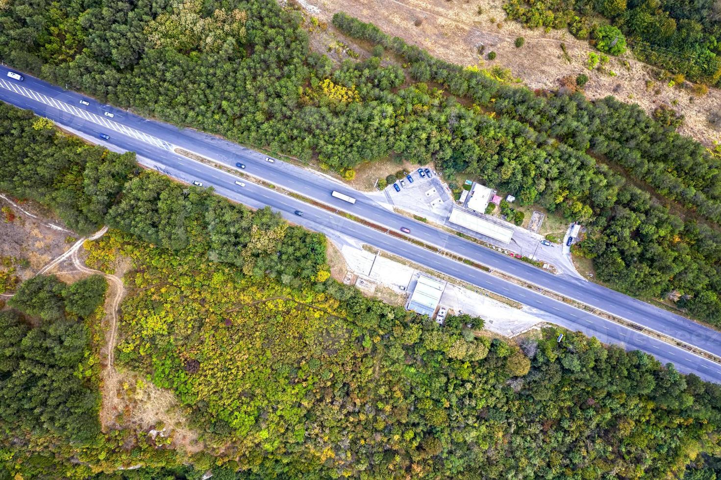 Aerial view of the road with cars and petrol station. Top view photo